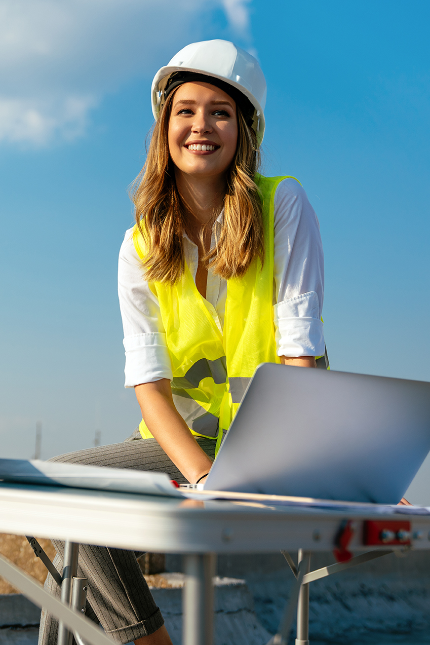 Construction concept of engineer or architect woman working at construction site. Business people concept.